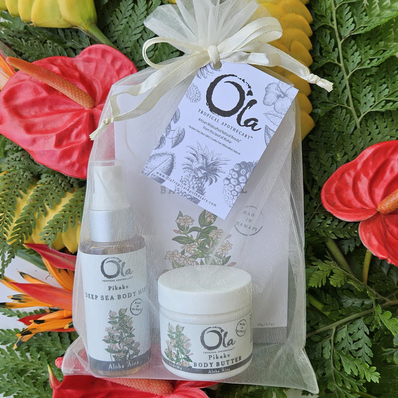 A luxurious spa gift set including Pikake scented sea salt soak, mineralizing deep sea mist, and body butter, all packaged in  an organza bag with a branded hang tag. Travel friendly. Great value